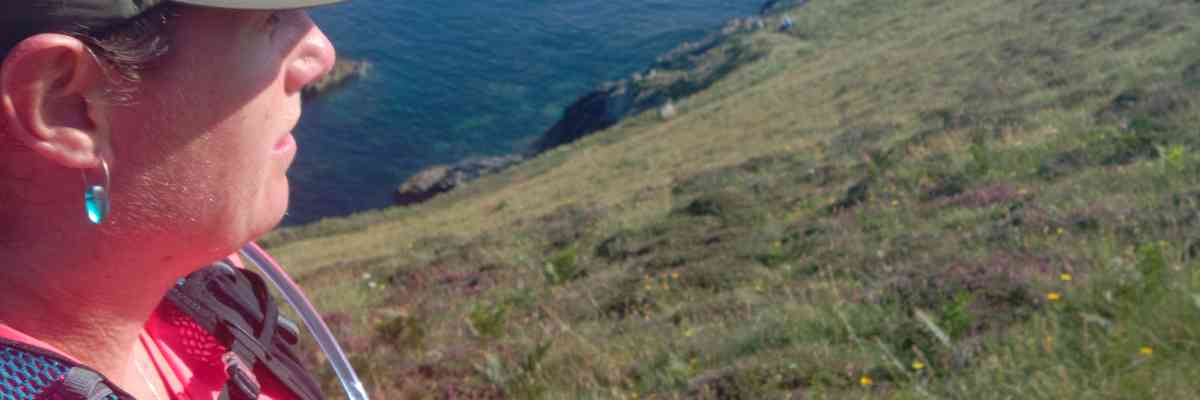 Female out running on the coast path